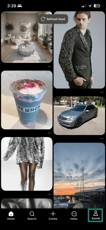 iOS Pinterest app home screen with the Saved button highlighted.