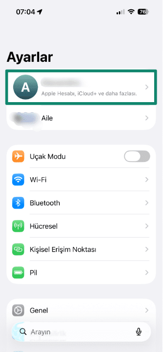 Screenshot showing Apple ID in the iPhone Settings menu